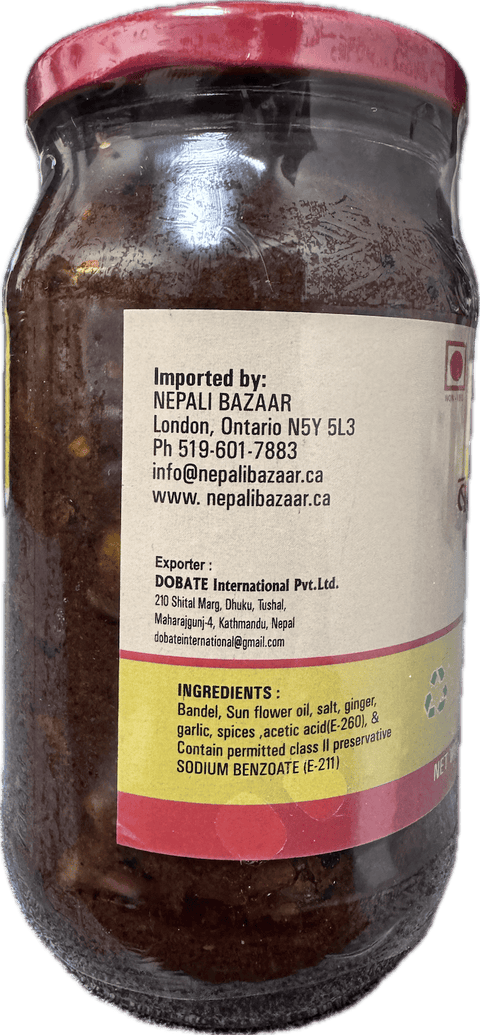 A glass bottle showing Badel Achar (Wild Boar Pickle) from Kalo Kalki of 380g with ingredients