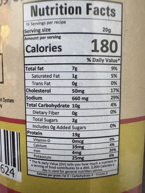 A glass bottle showing Badel Achar (Wild Boar Pickle) from Kalo Kalki of 380g with nutrition facts