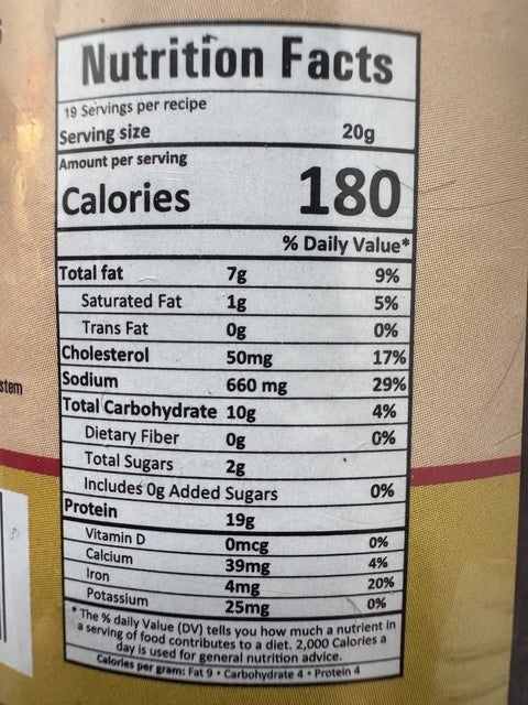 A glass bottle showing Kukhura Achar (Chicken Pickle) from Kalo Kalki of 380g with nutrition facts