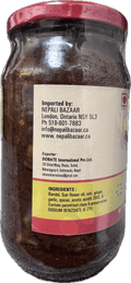 A glass bottle showing Badel Achar (Wild Boar Pickle) from Kalo Kalki of 380g with ingredients